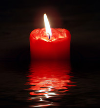Red Candle With Reflection