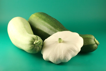 Two  marrows and bush pumpkin on a green background.