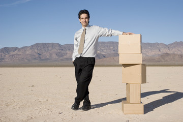 Canvas Print - Businessman organizing boxes