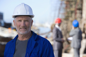 Sticker - Oil rig survey engineers with one in foreground