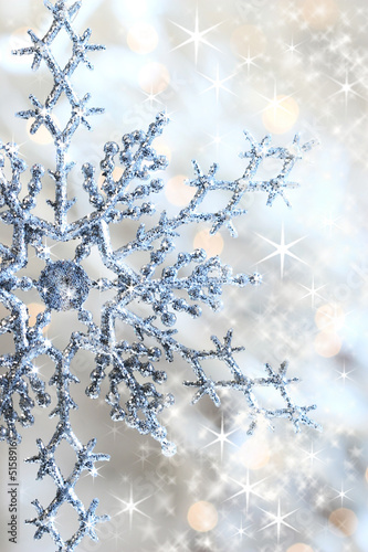 Obraz w ramie Closeup of snowflake with stars
