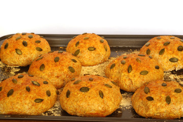 Wall Mural - Rolls with pumpkin seed on baking tray