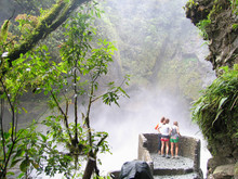 Hikers At The Pailon Del Diablo Waterfall Near Banos, Ecuador