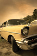 Head lamp of yellow classic car in sepia color tone