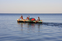 Malagasy Fishermen And Their Outrigger Canoes