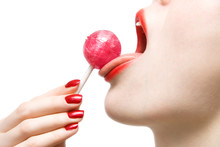 Woman Licking Sweet Sugar Candy Closeup. Isolated On White.