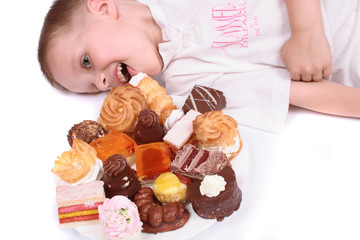 Wall Mural -  boy is eating sweet desert on the white background