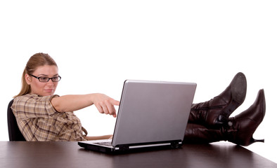 Business woman working by laptop.