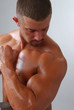 A muscular bodybuilder flexing his bicep