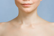 Image of young woman's lips, chin and shoulders