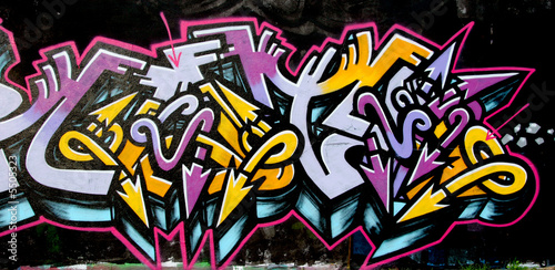 grafitti tag yellow and purple © fnalphotos.com