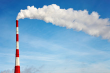 Air Polluting Smokestack Against Blue Sky