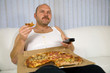 © Simone van den Berg - Overweight mature man sitting on the couch