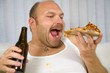 Overweight mature man with pizza  