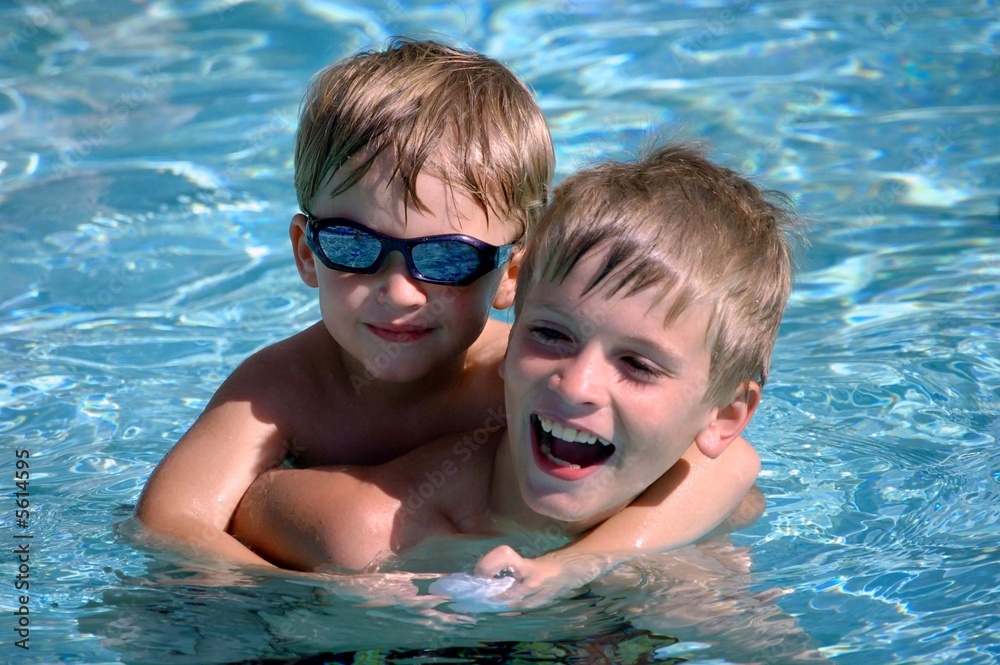 Brothers in a Swimming Pool Stock Photo | Adobe Stock