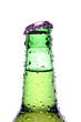 Leinwandbild Motiv beer bottle with water droplets, closeup isolated on white