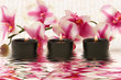 Leinwandbild Motiv Aromatherapy candles and pink orchid