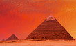 Ancient egyptian pyramids at red sunset
