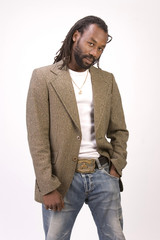 A black man with dreadlock hair isolated on a white background.