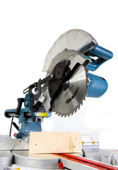 Wall Mural - Mitre Saw in White Background and Crosscut Timber