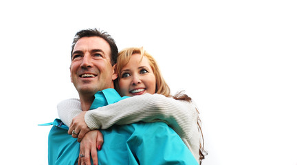 happy couple is  smiling against white background