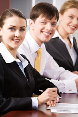 Poster - Row of smiling business people looking at camera