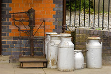 Milk Churns Waiting On The Station Of A Victorian Railway