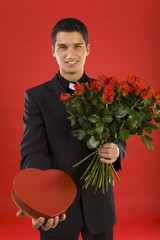 Wall Mural - handsome businessman, with bouquet of roses