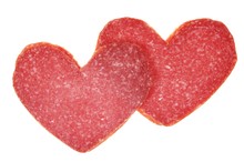 Two Red Salami Hearts Isolated On White Background