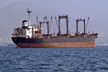 Anchored cargo ship