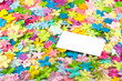 © Rebecca Lansdown - A white business card on a bed of spring colored flowers.