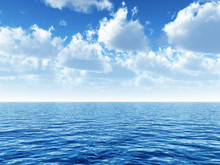 Cloudy Blue Sky Above A Blue Surface Of The Sea