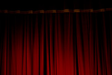 Red Velvet Curtains Of The Theater Stage
