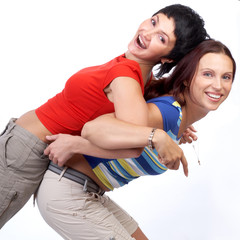 Happy beautiful young women laughing. Isolated over white.