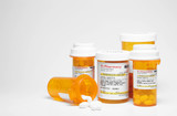 Fototapeta Na ścianę - Prescription pills in plastic medicine bottles.