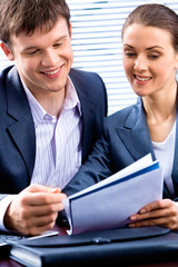 Sticker - Image of young lady and business man looking at document 