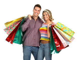 Wall Mural - shopping couple smiling. isolated over white background.