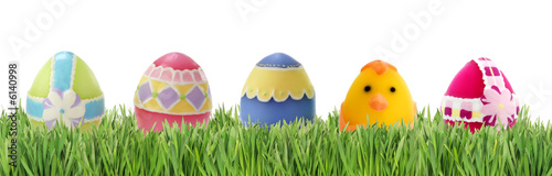 Easter eggs in grass isolated on white background