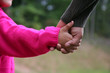© Rob - A mixed race mother and daughter holding hands