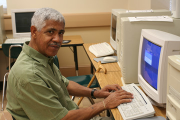 Senior citizen learning computer skills