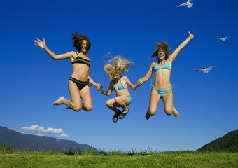 two girls having fun with a child.