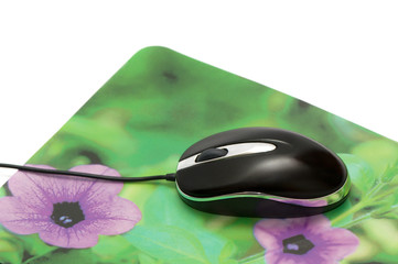 computer mouse and mouse pad isolated on a white background.