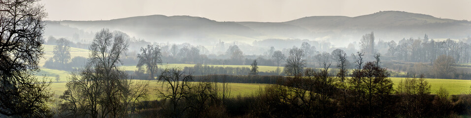 Wall Mural - A view over misty countryside