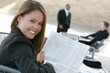 © Stephen Coburn - A  pretty business woman reading the newspaper