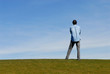 © gdphoto - Man standing on hill with arms crossed