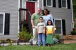 © Rob - A family standing in front of their home