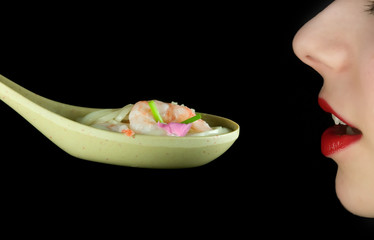 woman eating miso or chinese soup from spoon