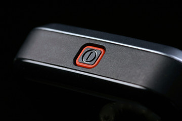 Wall Mural - part of a cell phone with red power button