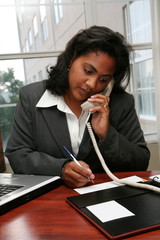 Sticker - businesswoman working on a computer in an office