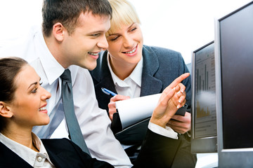 Sticker - Portrait of three business people sitting near computer 